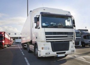 Driving at Work - Driver & Operator law & risks - Images shows Truck driver and his truck - waiting for a ferry